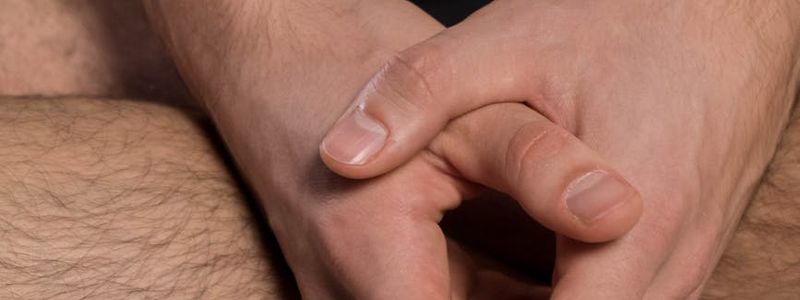 Close up of hands in a mudra position during practice.